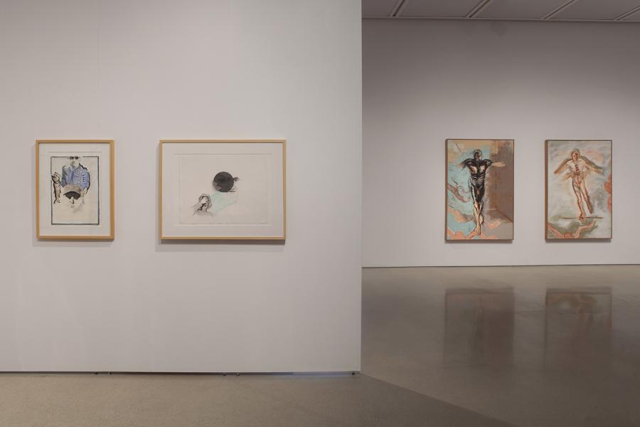 A pair of framed drawings by Sheila Butler, exploring themes of identity and introspection, juxtaposed with her bold painted works in the background.