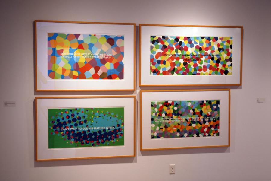 Four artworks on a wall, comprising colourful dotted textures obscuring uppercase captions. Clockwise from the top left, they read “don’t you just hate it when the ‘I don’t normally party’ people start to party?” in white text, “top secret two step program to ensure happiness 1. Collect vices 2. Maintain vices” in black text, “well, I guess there is nothing left to do but put away the bottles, sweep up the eyeballs and lock the front door” in white text, and “I can’t wait to see his mature work.”