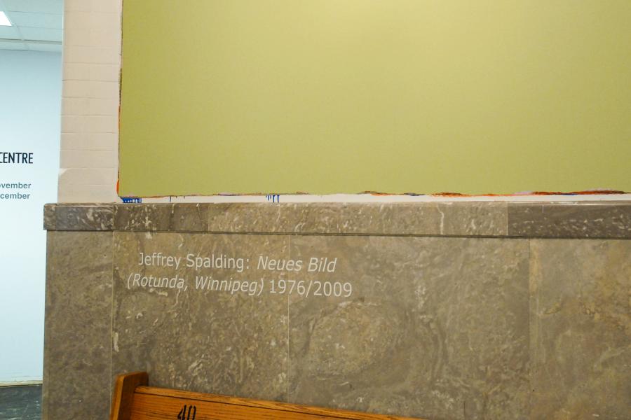 Close-up of Jeffrey Spalding's Neues Bild (Rotunda, Winnipeg) wall installation with the title projected onto the stone wall.