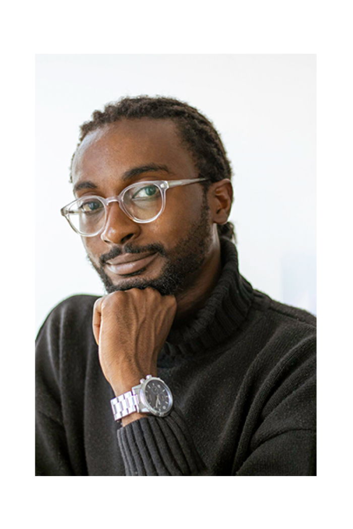 Headshot of Labour Studies alum Hafiz Jatto in front of a white background.