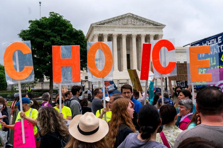 Abortion-rights demonstrators hold up letters spelling out "my choice," Saturday, May 14, 2022, outside the United States Supreme Court in Washington, D.C.