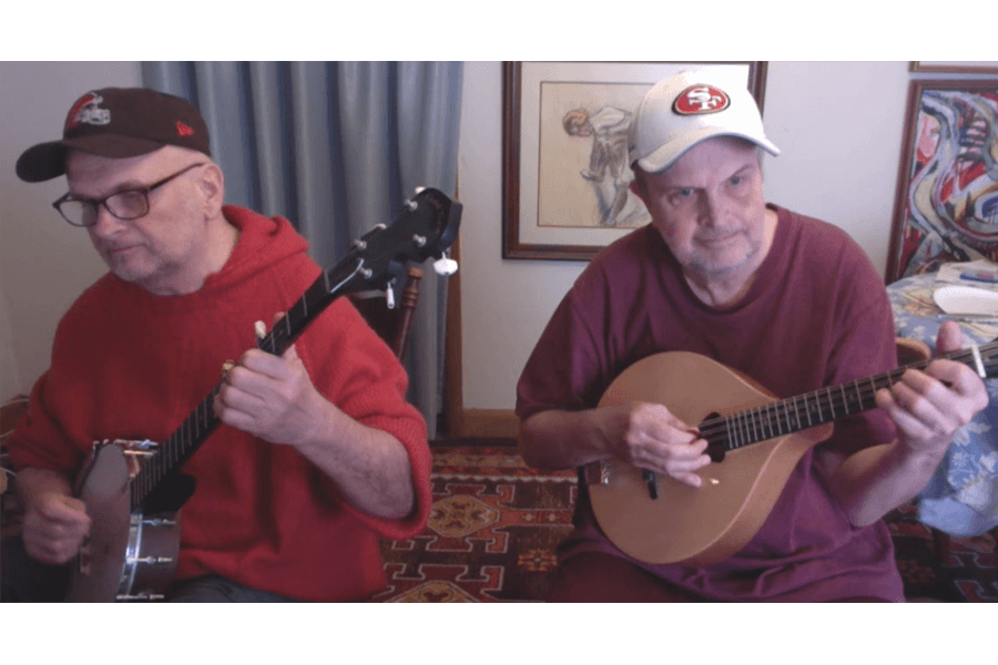John and Charles Hatfield play instruments together.