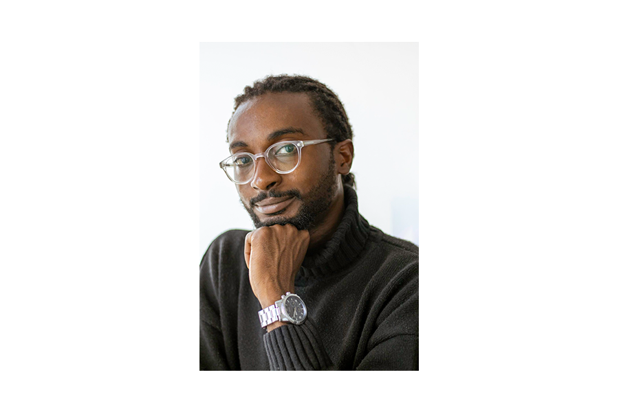 Headshot of Labour Studies alum Hafiz Jatto in front of a white background.