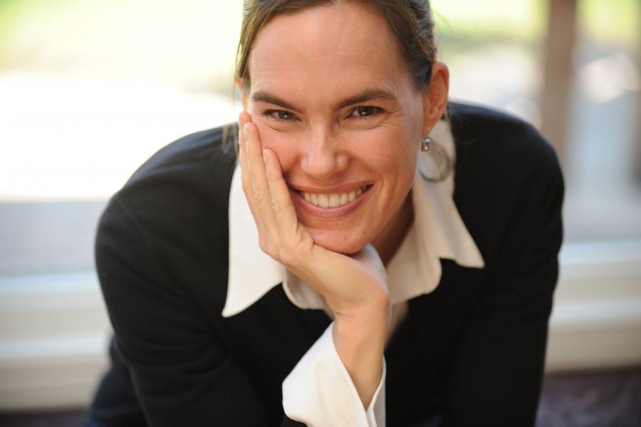 Headshot of Dr. Andrea Charron smiling.