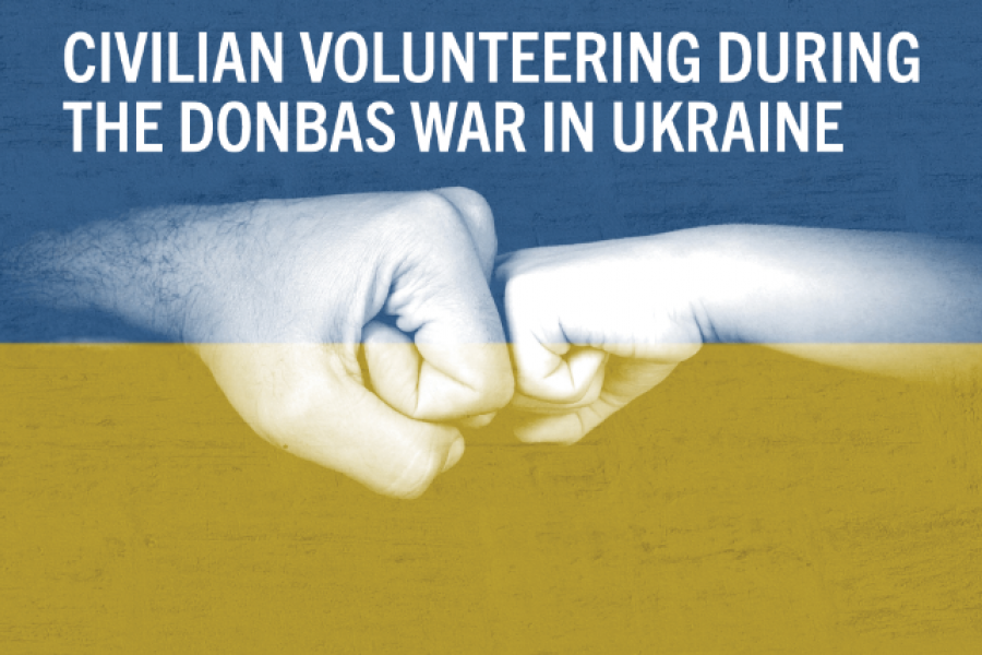Photo of two hands fistbumping overlaying the Ukrainian flag blue and yellow.