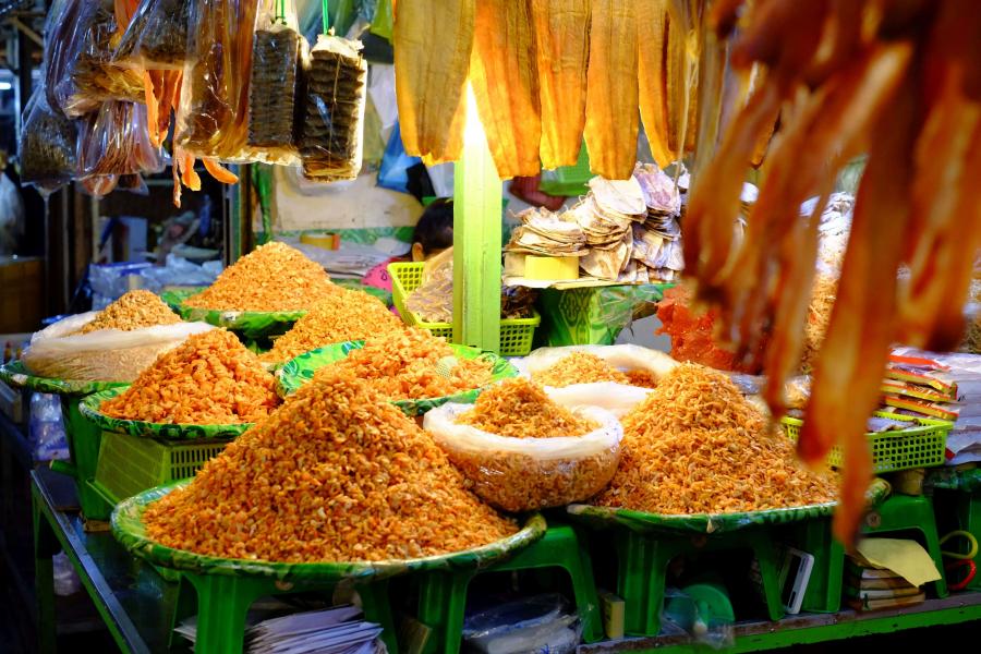 Bowls of dried fish in an outdoor market stall in Phnom Penh.