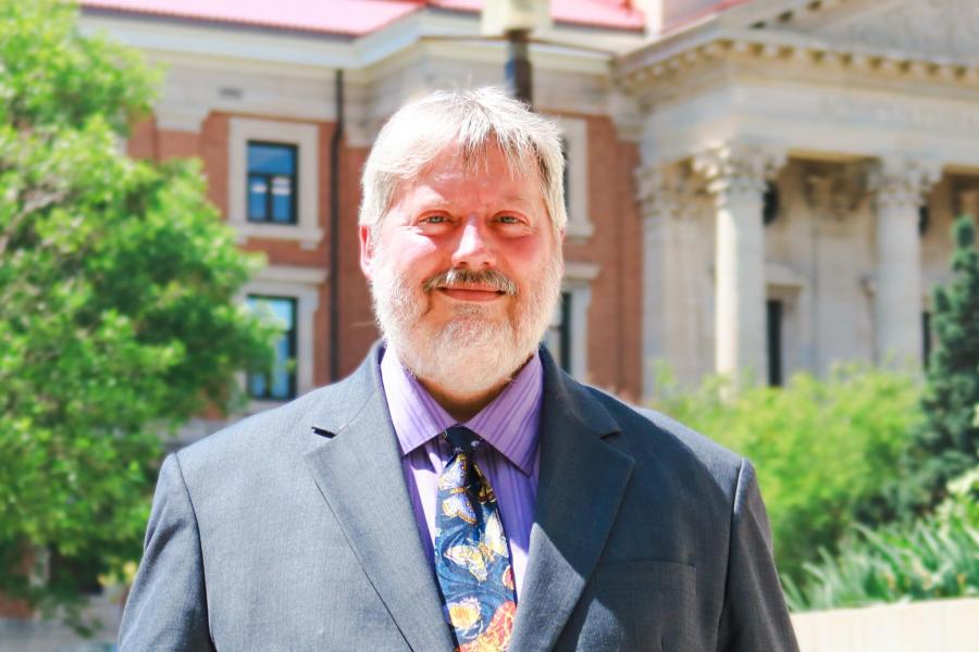 A photo of Rob Hoppa in front of University of Manitoba administrative building.