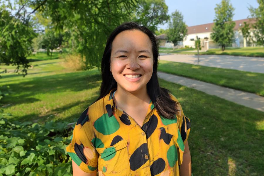 Headshot of Carolina Chang wearing multicoloured geometric blouse.