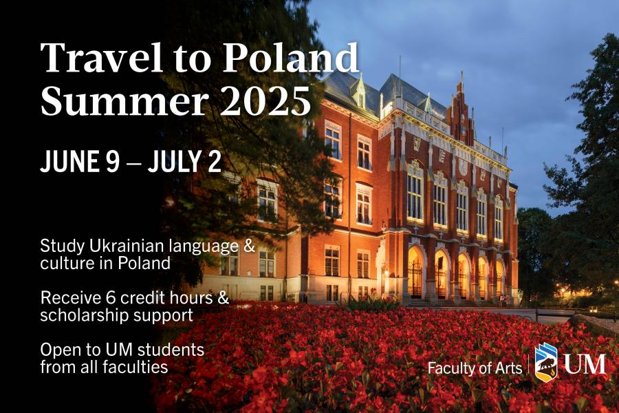 The facade of a Polish university building uplit at night.