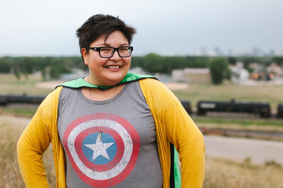 Sonya Ballantyne wearing a green cape and a shirt with Captain America shield print