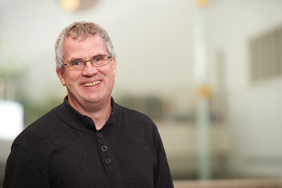 Professor Bruno Dyck's professional shoot. He is wearing a black polo shirt