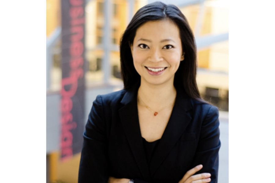 Professor Chi Liao wears a black blazer with black shirt. She is smiling