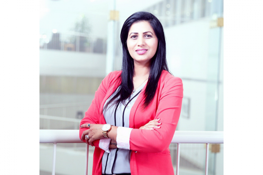 Jasmine Brar wearing a red blazer