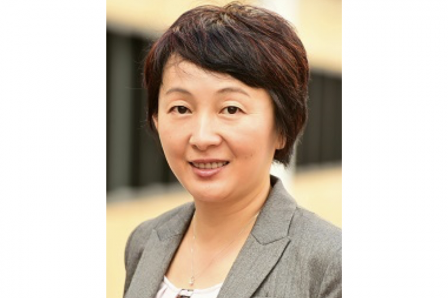 portrait of assistant professor Rong Zeng. she has  a short bob and wears a grey blazer