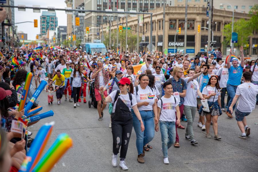 people in white tees at the winnipeg pride parade