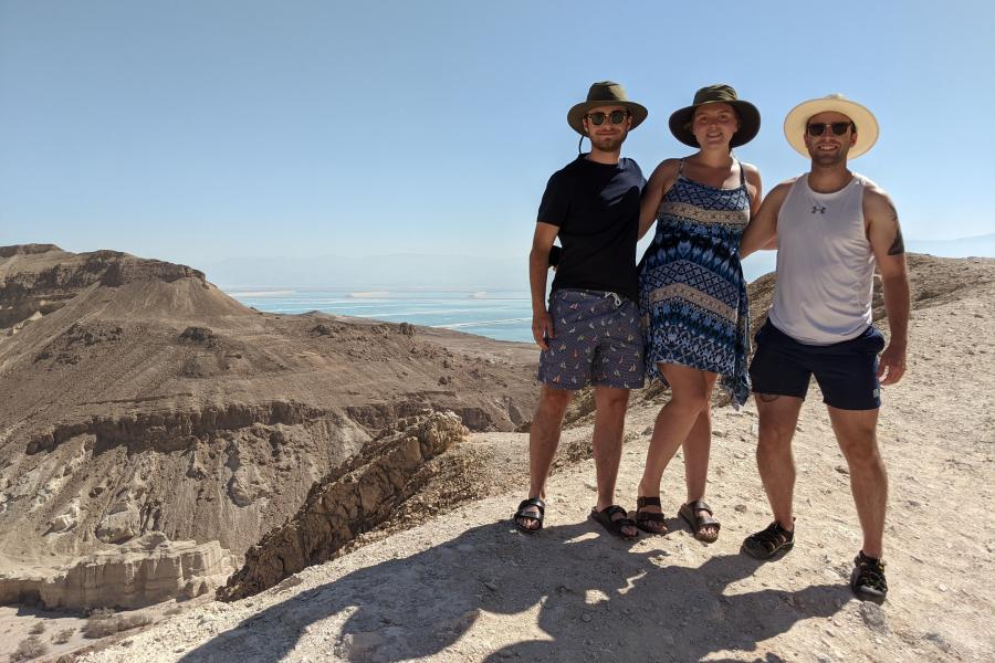 Three students standing in the Judean Desert