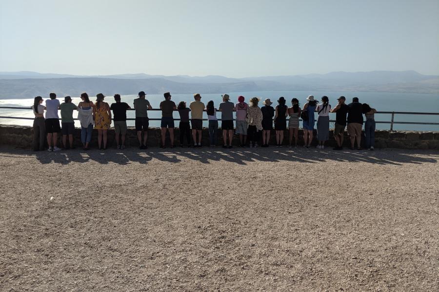 Students standing at the Sea of Galilee