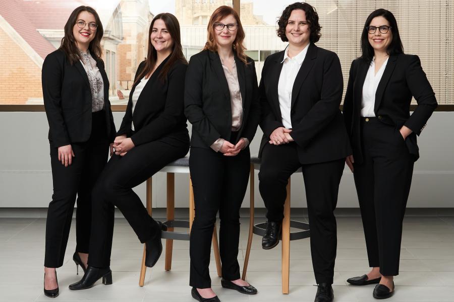 The winning team of women standing in a line.