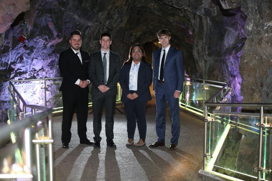Four students at a mining competition