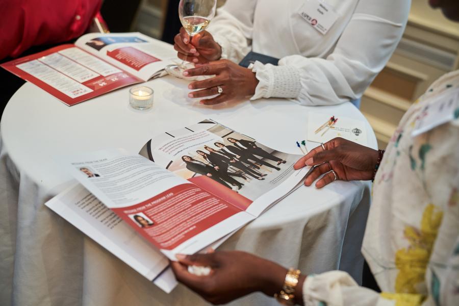 Person reading 2023 Case Competition Impact Report