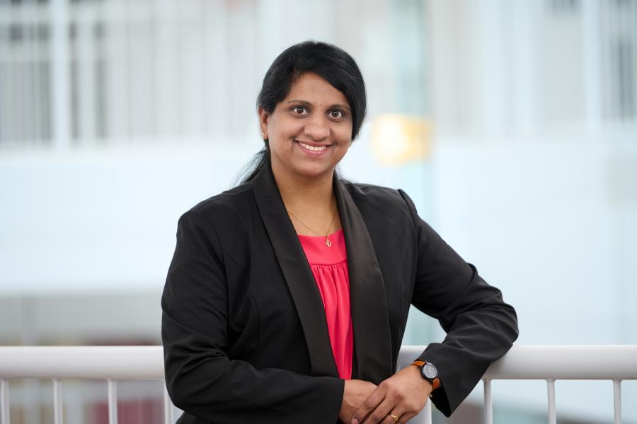 Deepika Kalluri smiling in her portrait headshot