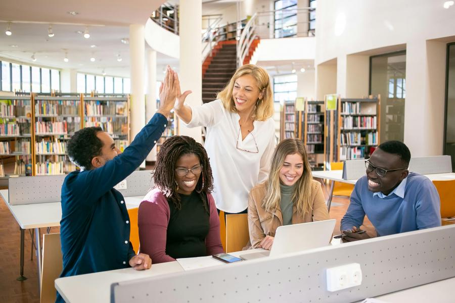 students interacting in library