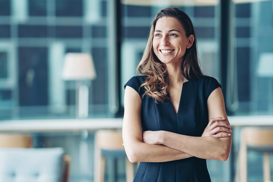 Woman executive in formal office setting.