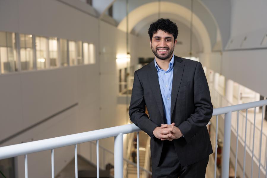 Pouyan Tabasi Nejad wearing a suit and collared button up shirt.
