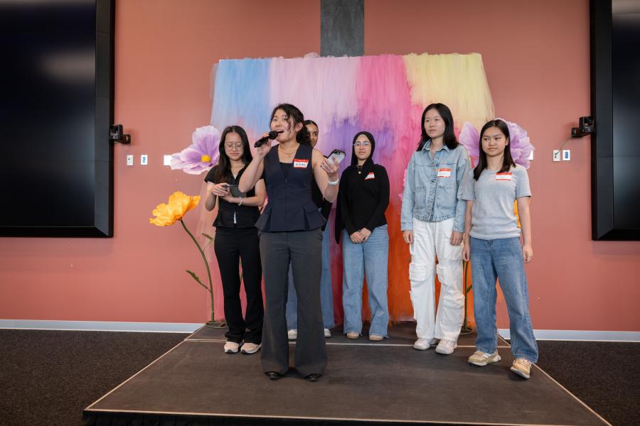 students on stage pitching
