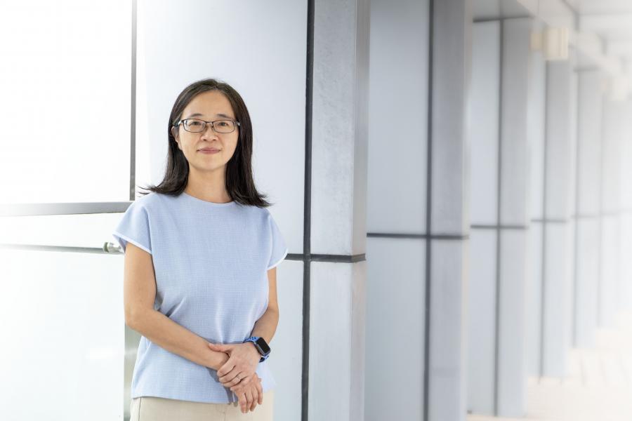 Image of a woman wearing a blue top.