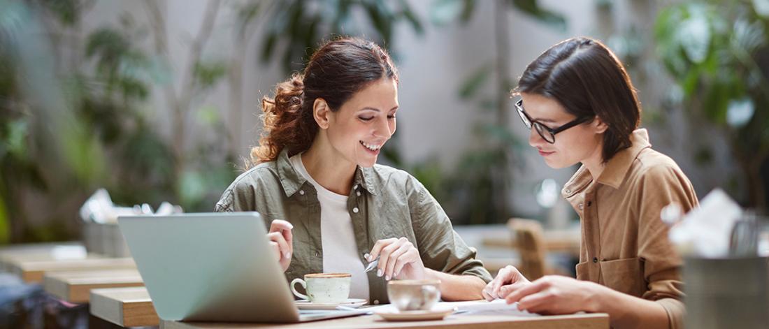 Two students working on assignments together.
