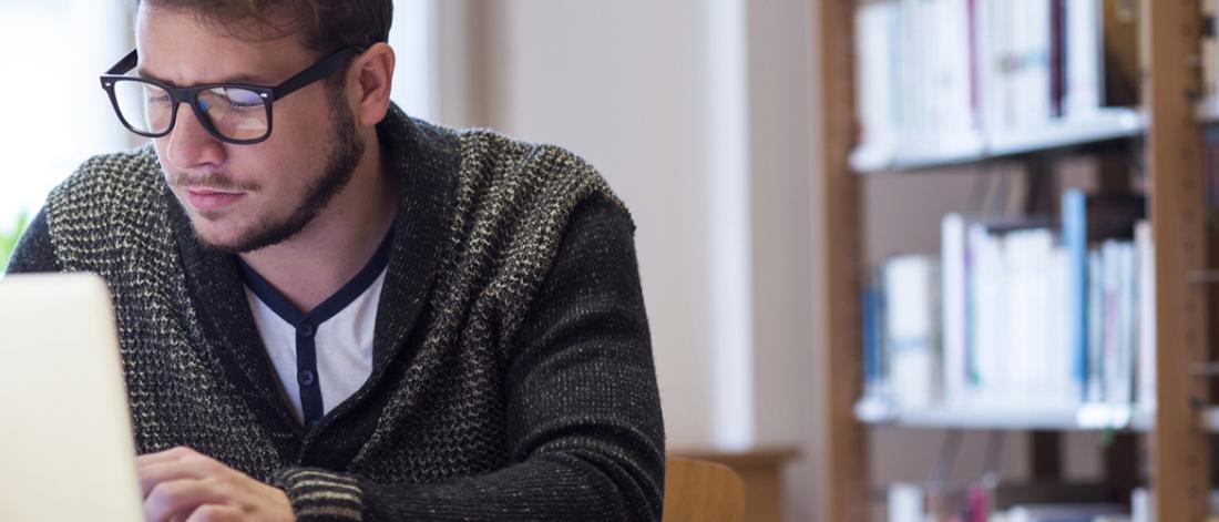 Student studying in library.