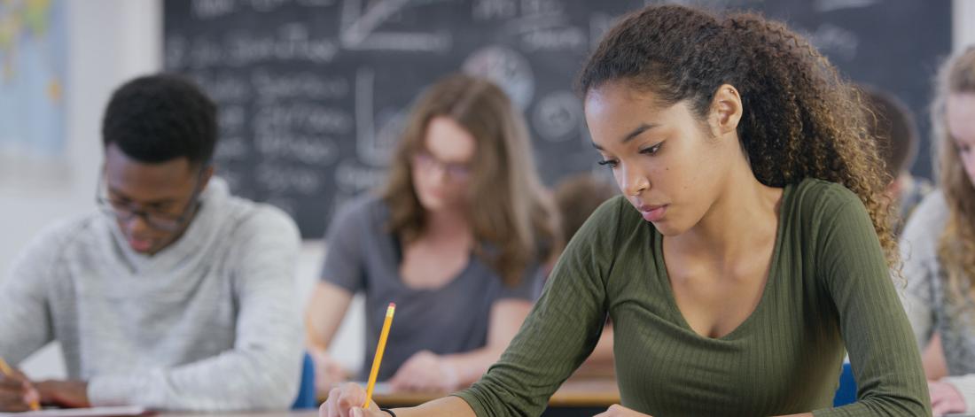 Young adults taking a test