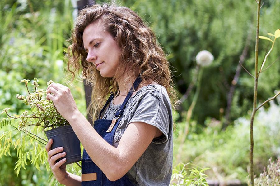 Student working in community garden.