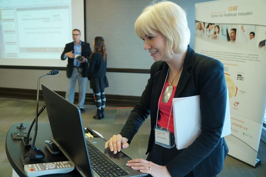 Presenter at a laptop.