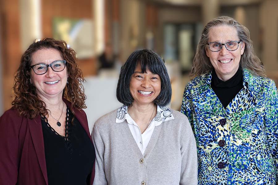 The Centre on Aging's Associate Director, Communications coordinator, and Director are smiling.