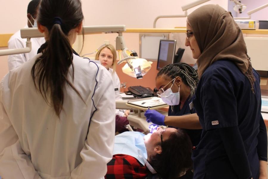 Students watching a dental hygiene demonstration