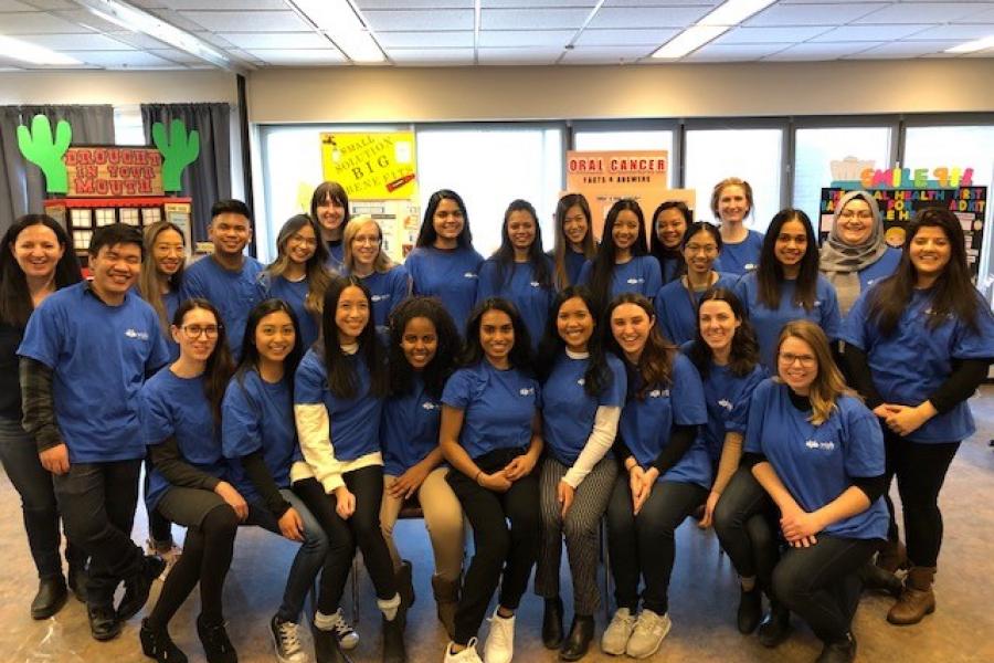 A group shot of volunteers in matching shirts.