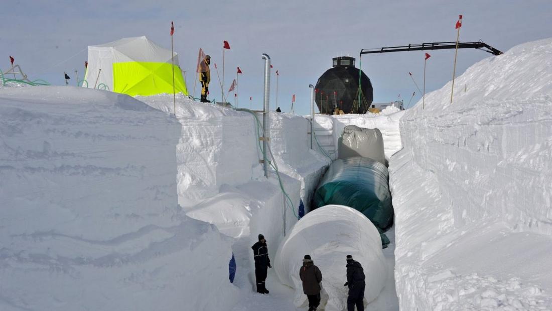 image of researchers building a snow tunnel
