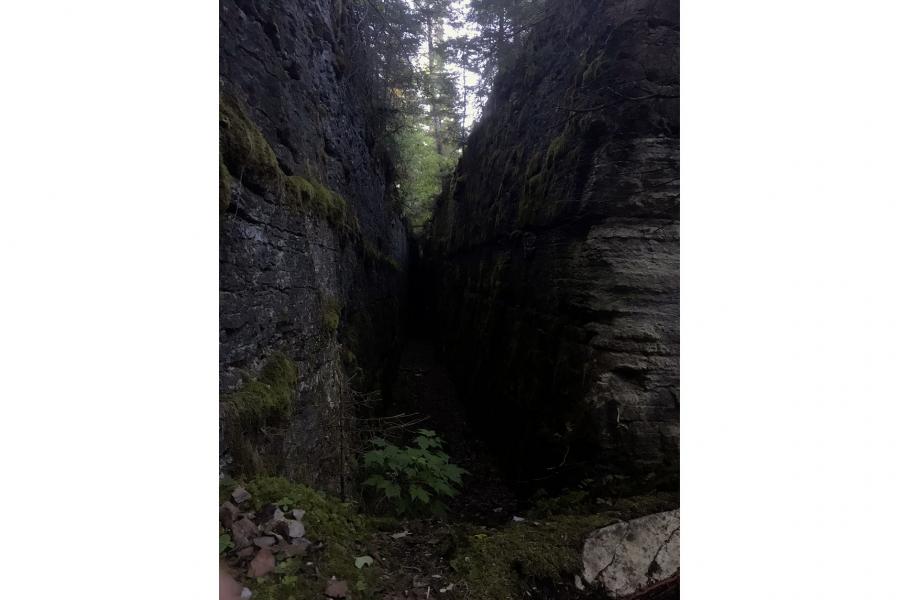 a narrow crevice in the pine dock limestone caves on lake winnipeg.