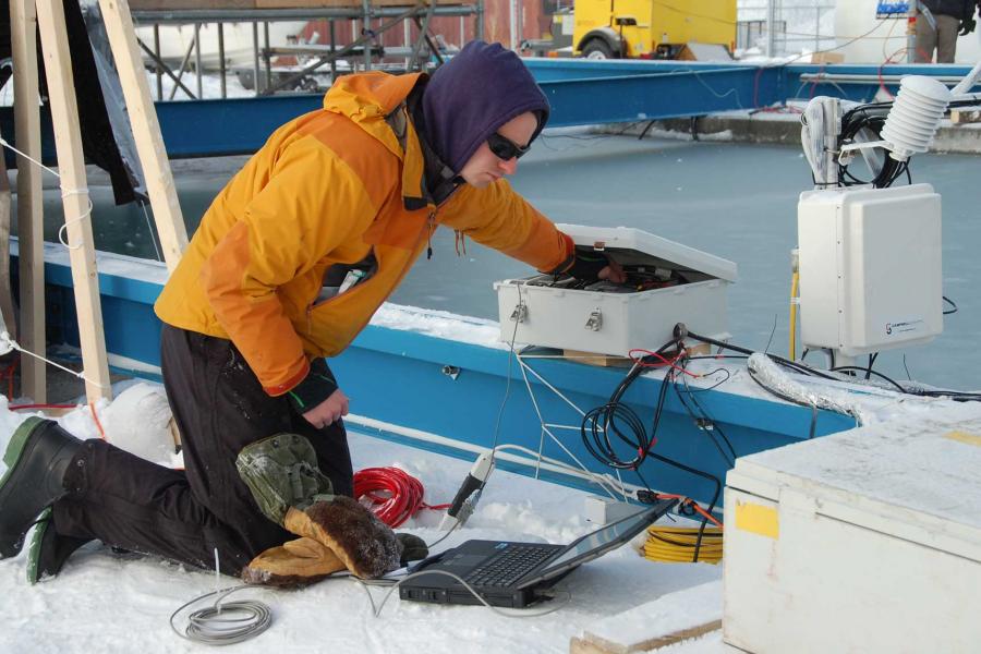 A researcher taking a reading of ice samples collected at the SERF.