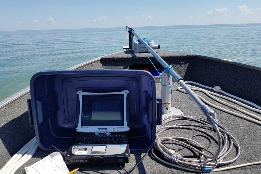  portable analytical spectral device attached to a fiber optic cable (bow of boat) collects reflectance data.