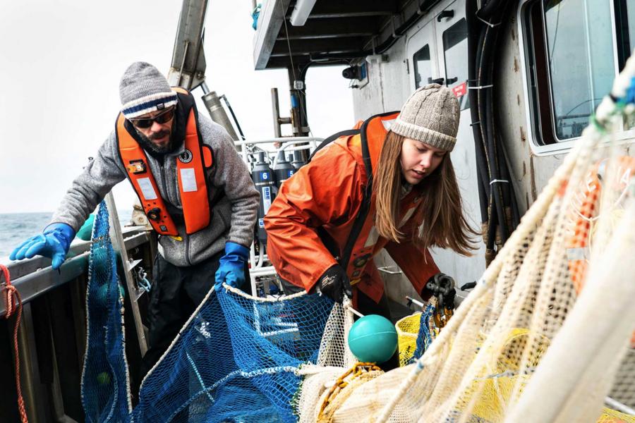 Researchers preparing nets aboard the research vessel William Kennedy.