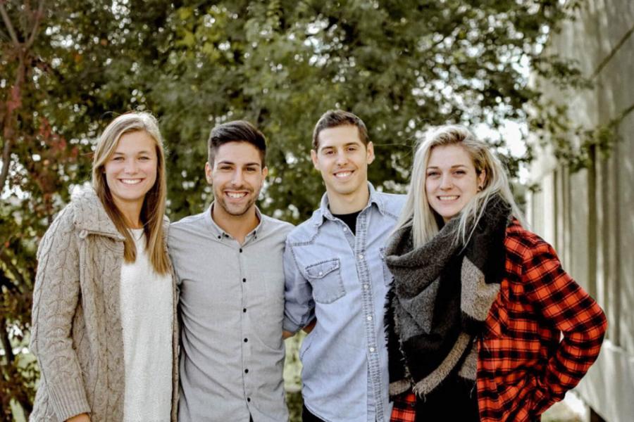 Four members of the Faculty of Education Student Council stand together side by side.