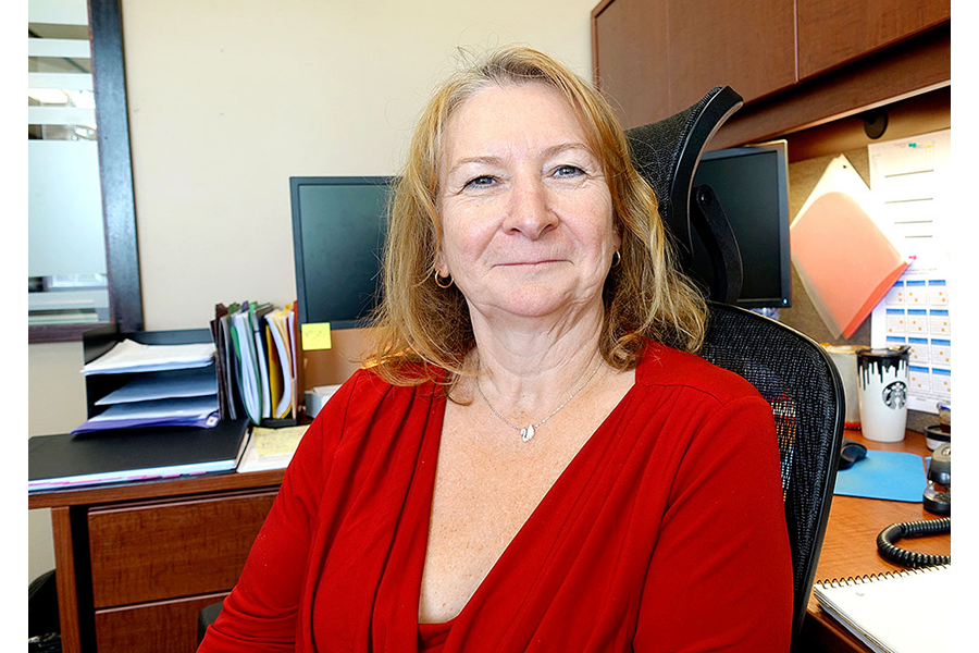 woman looking at the camera using a red shirt