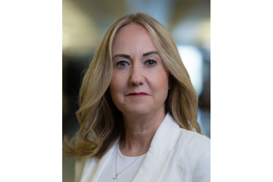 head shot woman with longer blonde hair