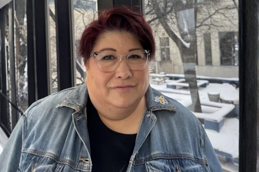 head shot woman with short dark hair and glasses