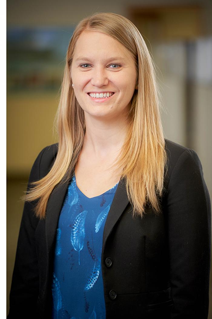 Vanessa Krahn stands smiling and posing for the camera.