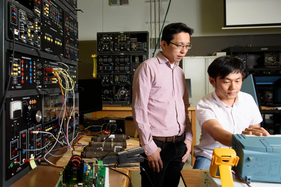 A professor and student work in a lab. 