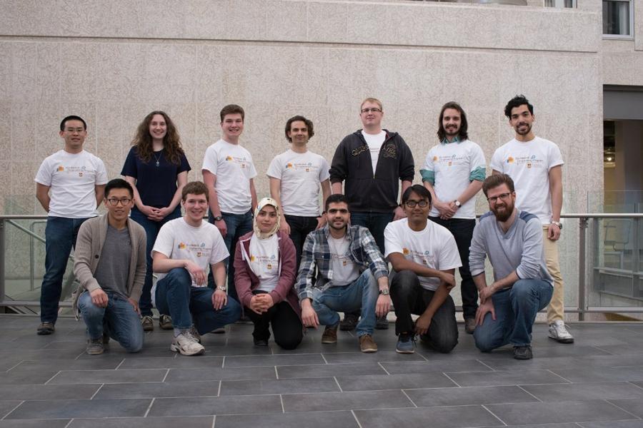 A group of biomedical engineering students smiling and posing for the camera.